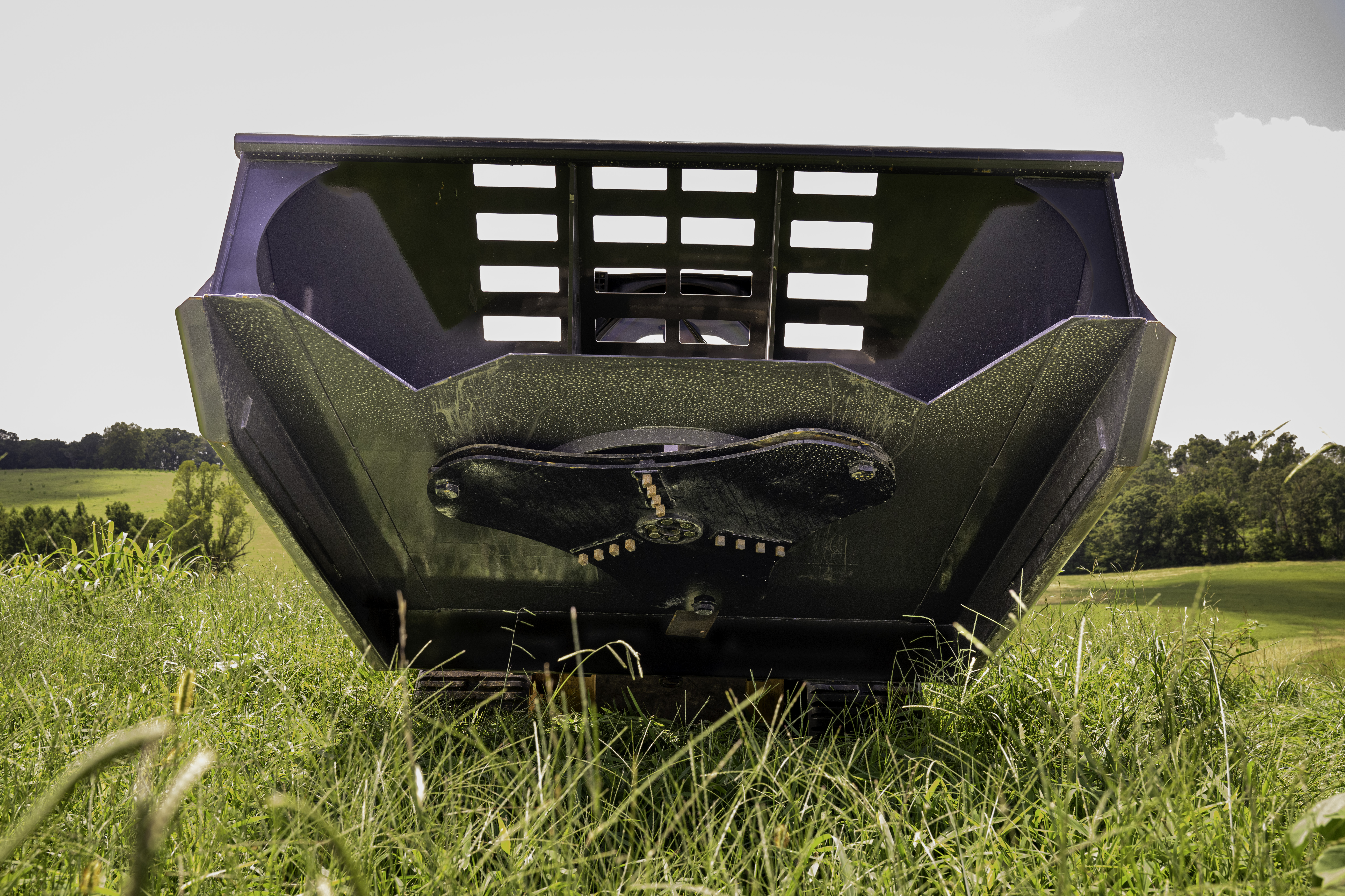 Commercial and government skid steer and excavator attachments from CID, including swing boom brush cutters, grapples, buckets, and severe duty vegetation management equipment for municipal, DOT, forestry, and commercial fleet operations.