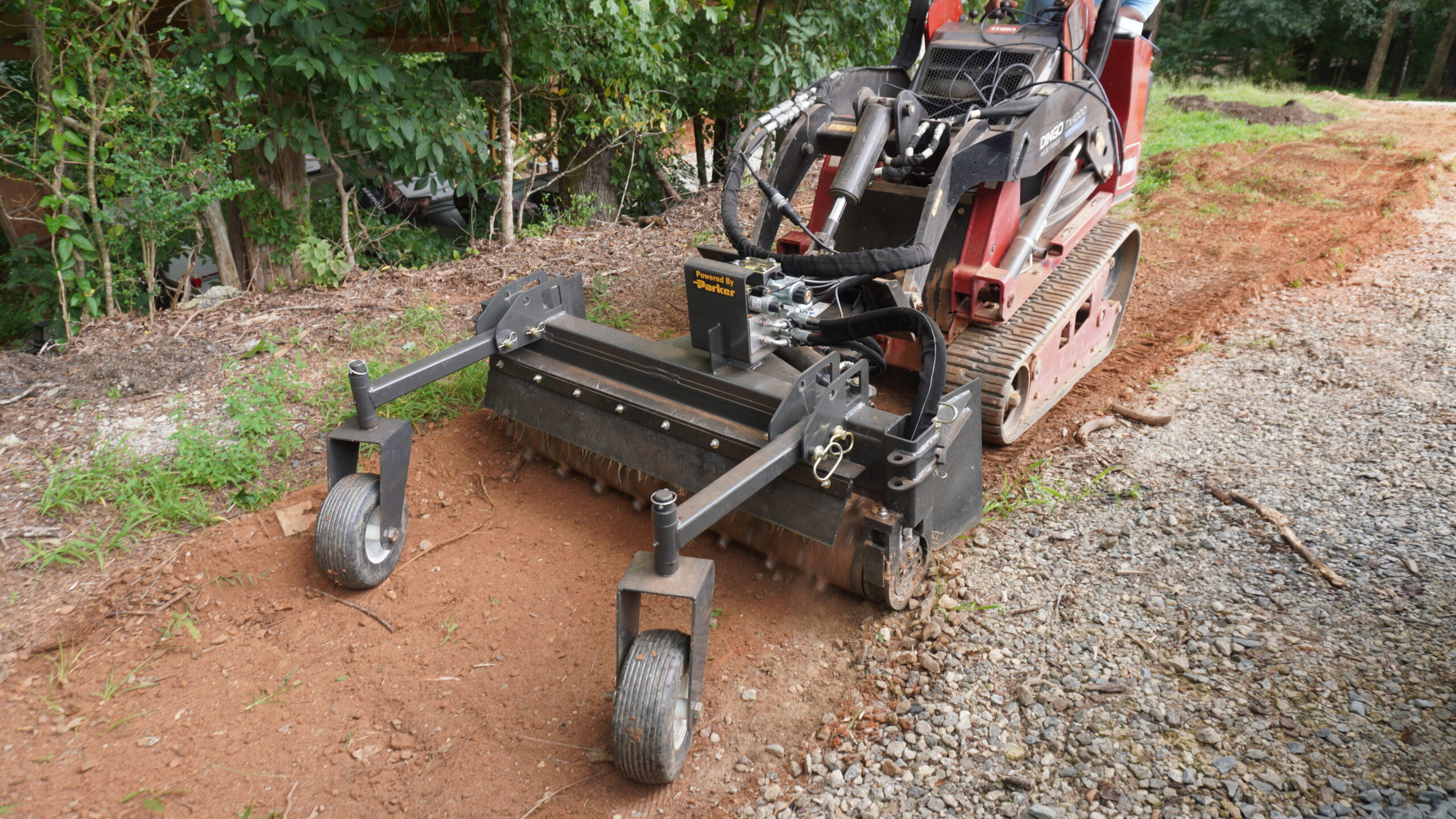 Commercial and government skid steer and excavator attachments from CID, including swing boom brush cutters, grapples, buckets, and severe duty vegetation management equipment for municipal, DOT, forestry, and commercial fleet operations.
