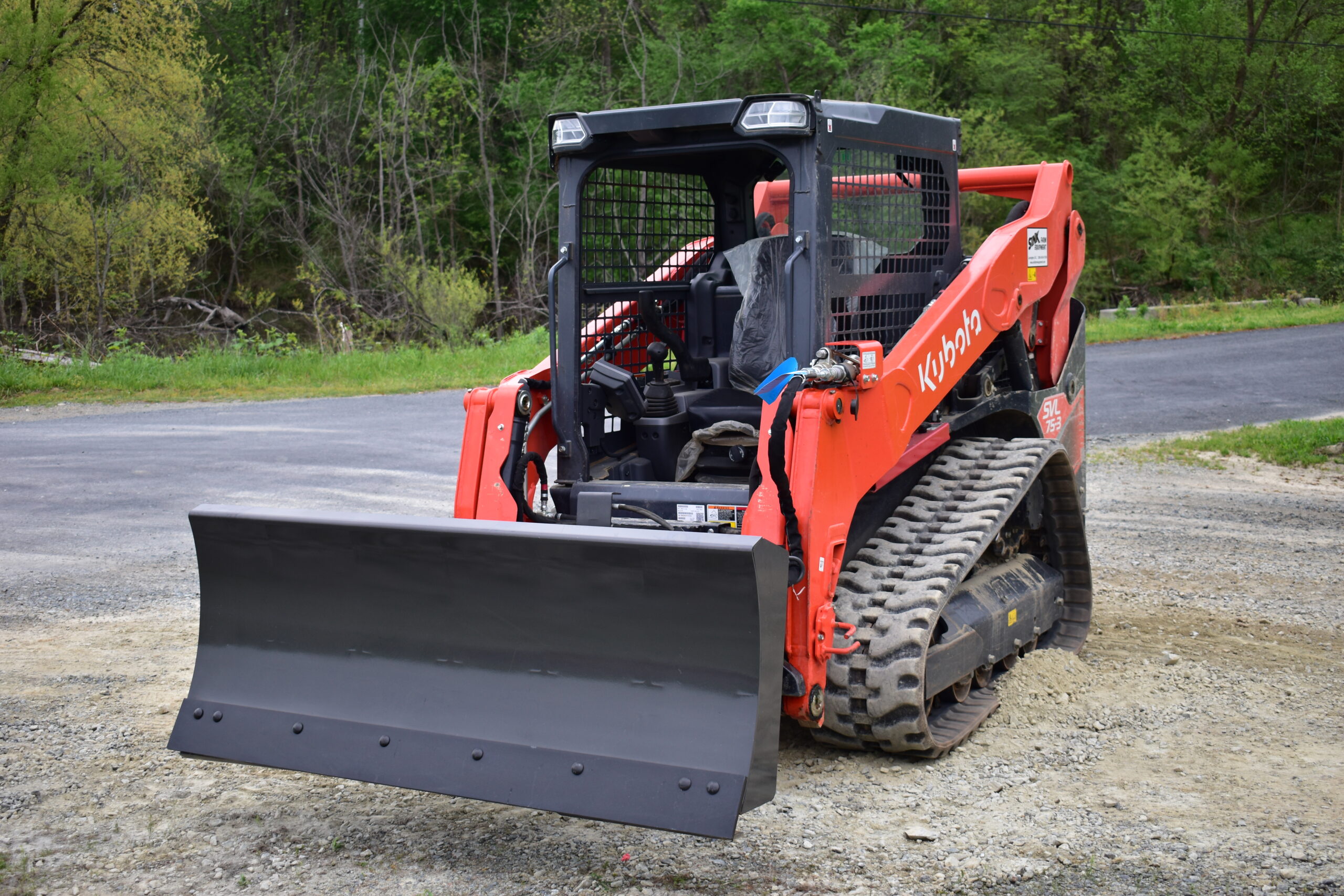 Commercial and government skid steer and excavator attachments from CID, including swing boom brush cutters, grapples, buckets, and severe duty vegetation management equipment for municipal, DOT, forestry, and commercial fleet operations.