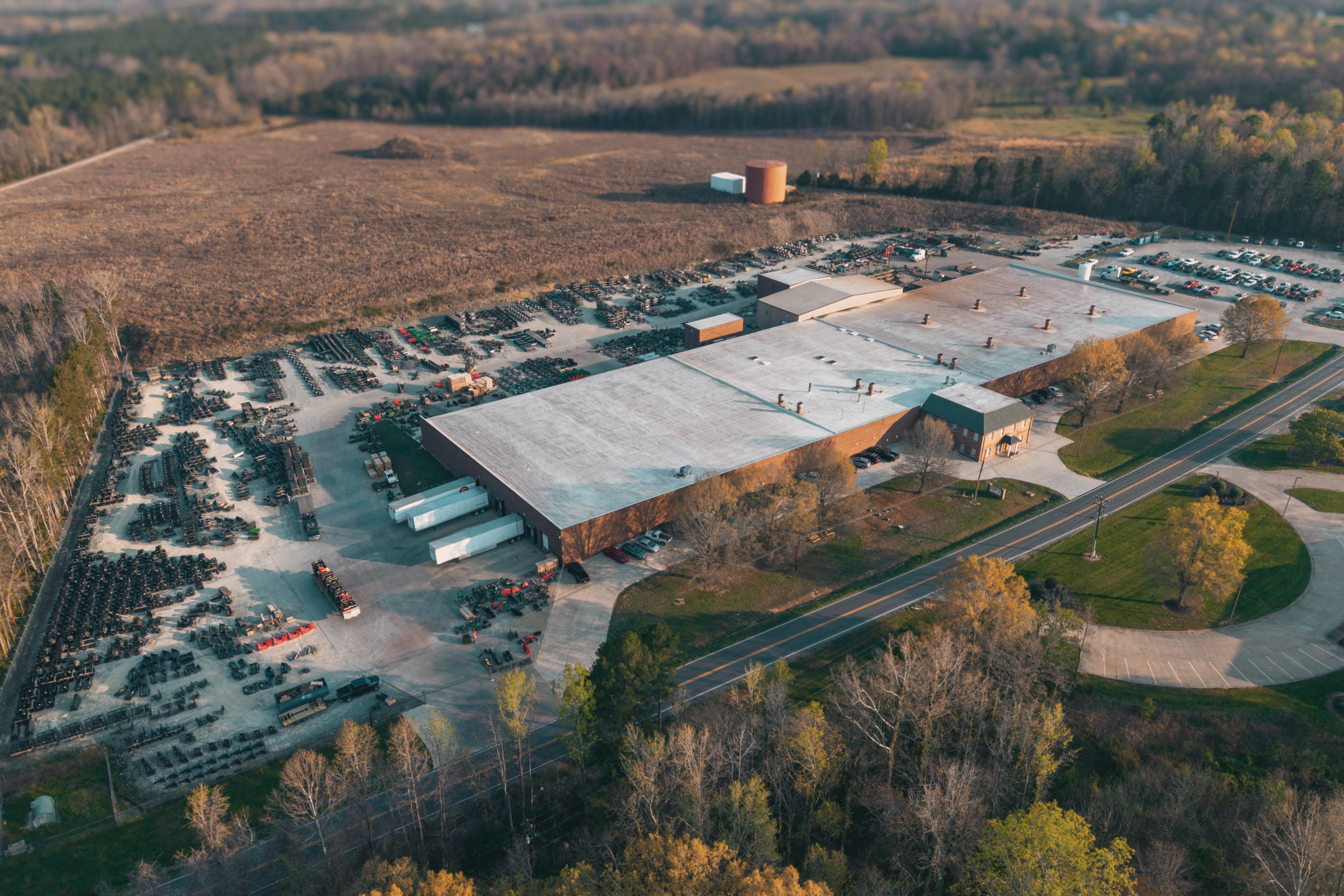 Commercial and government skid steer and excavator attachments from CID, including swing boom brush cutters, grapples, buckets, and severe duty vegetation management equipment for municipal, DOT, forestry, and commercial fleet operations.